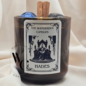 Hades Intention Candle with garnet, black obsidian, cinnamon, and Cerberus charm