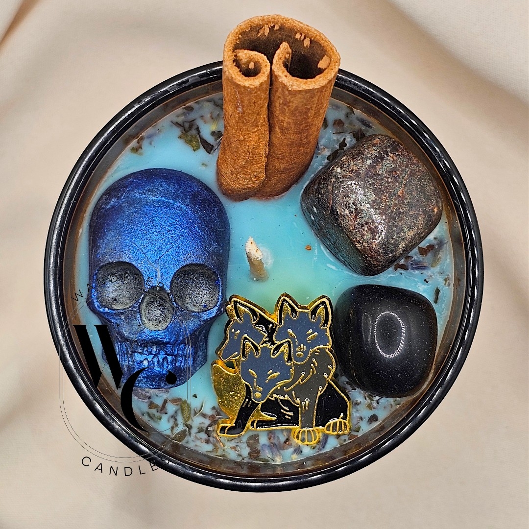Hades Intention Candle with garnet, black obsidian, cinnamon, and Cerberus charm