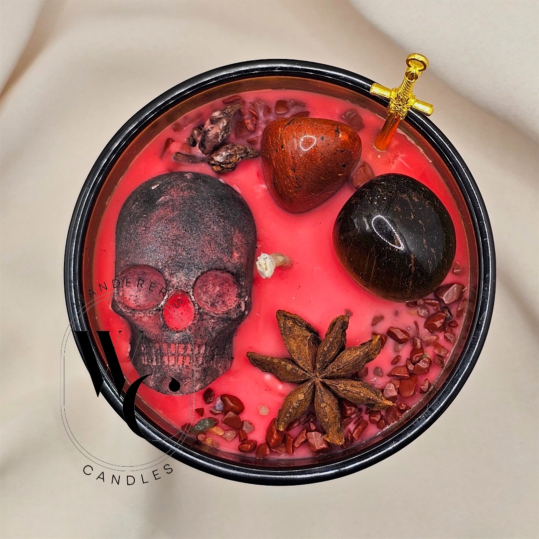 Close-up of Ares Intention Candle with red jasper and tiger's eye crystals